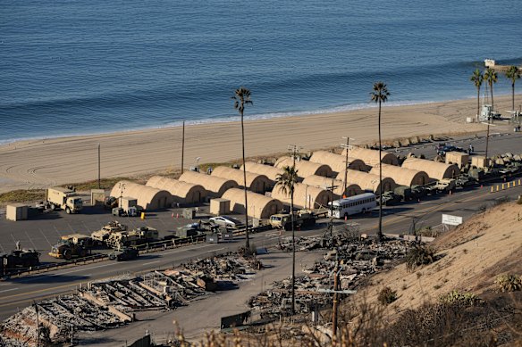 The Natio<em></em>nal Guard has set up a beachfront camp across from homes destroyed by the Palisades Fire in the Pacific Palisades.