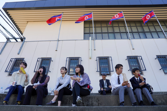 North Korean flags fly at the Aichi Korean Middle and High School in Japan, as past and current students celebrate the opening of a new building. 