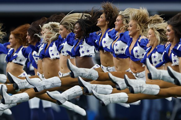 Dallas Cowboys cheerleaders performing their iconic jump splits at AT&T Stadium last year.