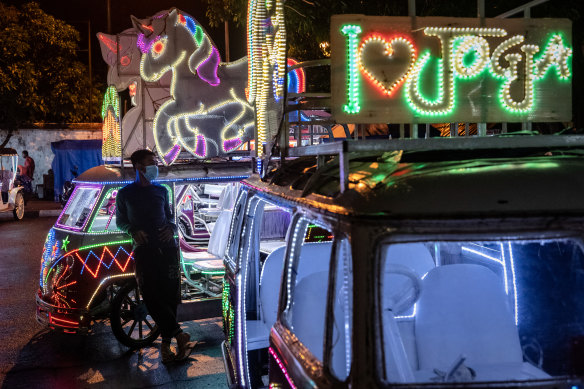 A rickshaw driver waits for customers in Yogyakarta - it's expected to take 15 months to vaccinate across Indonesia. 