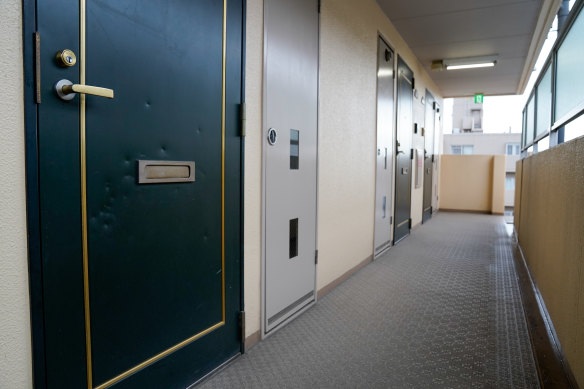 A series of dents can be seen on the front door of where assassin Tetsuya Yamagami used to live in Nara, Japan.