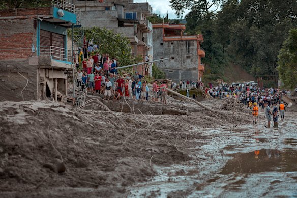 Residents in Trishuli, Nepal survey the damage, following the floods.