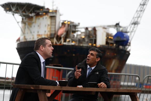 Britain’s Prime Minister Rishi Sunak, right, campaigns at the Port of Nigg, Scotland, with the leader of the Scottish Conservative party, Douglas Ross.