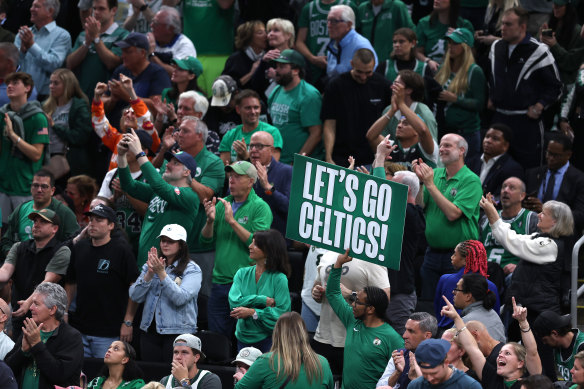 Celtics fans celebrate their win.