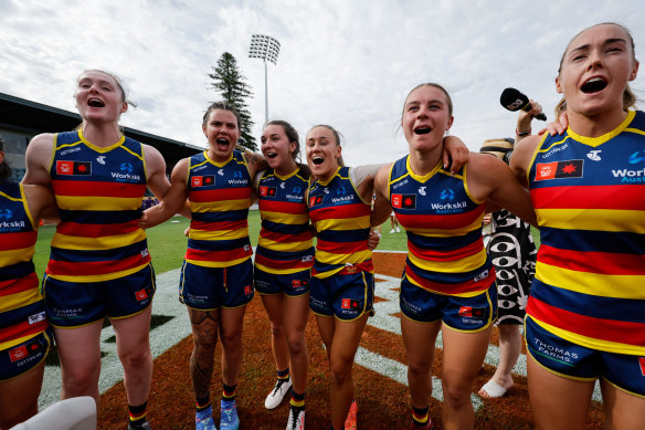 The Crows belt out their song after a commanding win over the visiting Dockers.