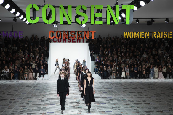 'Consent' signs were hung above the catwalk at Dior, where designer Maria Grazia Chiuri drew from her formative years.