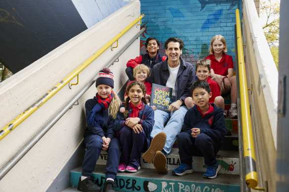 Andy Lee at Richmond Primary School with his nephews Freddy (left) and George Miles (right). The other students are (rear from left to right) Nikolas Daglis and Cece Dragovic; (front from left to right) Grace Miller, Manuela Valente and Theodore Ang.