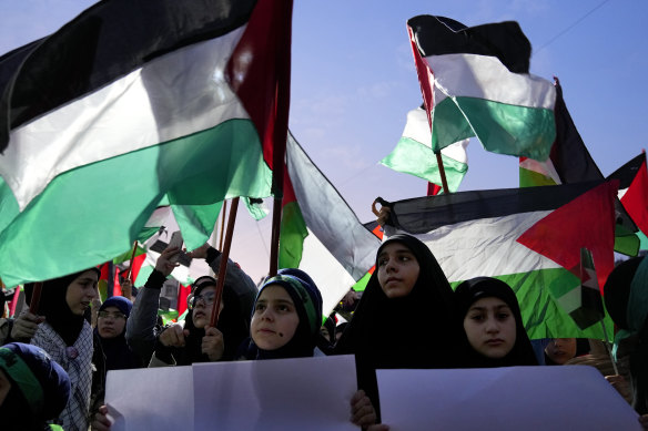 Hezbollah supporters in Beirut rally on Saturday to celebrate the Hamas attack on Israel.