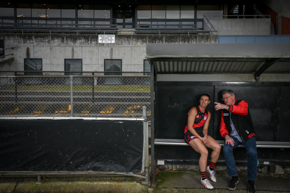 Essendon AFLW co-captain Bonnie Toogood and past premiership layer Simon Madden at Windy Hill.