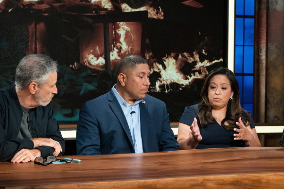 Jon Stewart with panellists Capt. Le Roy Torres (Ret.) and Rosie Torres on The Problem With Jon Stewart.