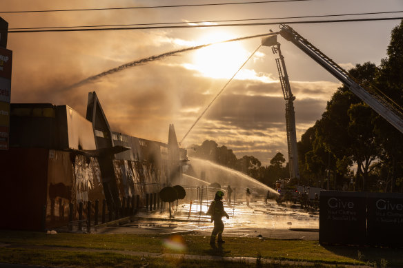 Firefighters battle a blaze at Supercheap Auto at Epping.