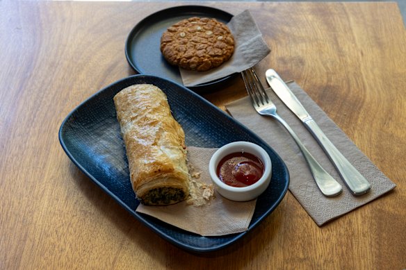 Lunch with Michael Kirby, comprising a spinach and ricotta roll and an Anzac biscuit at Streat cafe.