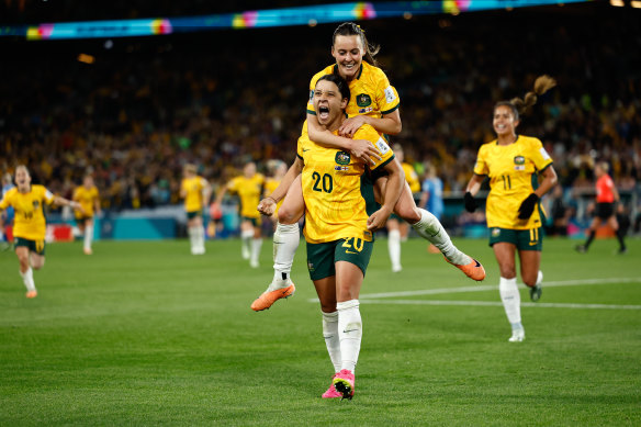 Hayley Raso celebrates with Sam Kerr, after Australia’s first goal.