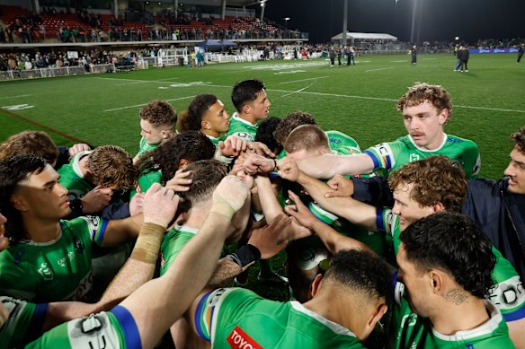 The Raiders take a moment after their victory in Mudgee.