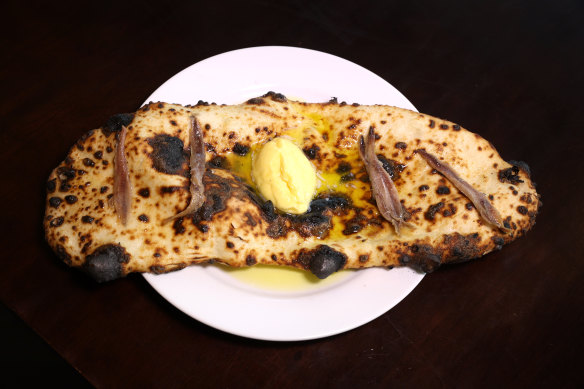 Wood-fired garlic flatbread.