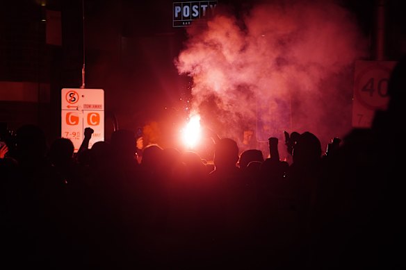 Fans in Swan Street, Richmond, set off flares ahead of the A-League grand final.