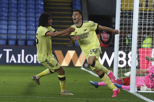 Gabriel Martinelli, right, celebrates the goal which kept Arsenal in the hunt for an unlikely European spot.