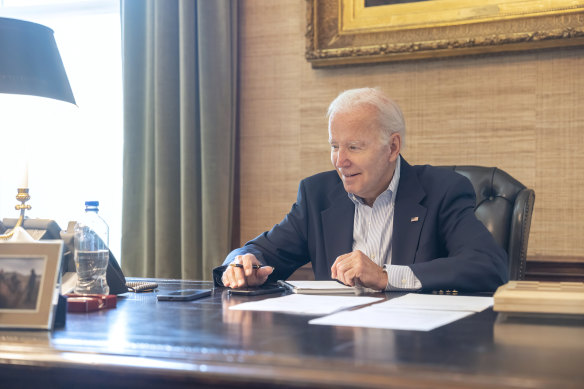 In this image provided by the White House, President Joe Biden on a phone call on Thursday, after he was diagnosed with COVID-19.