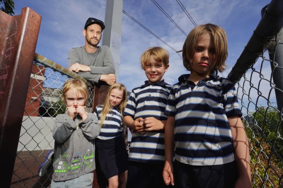 Chris Collier (rear) with his children - Louis, 4, and Lilith, 8 - and Gideon, 8, and Rupert, 6, Binstead in West Melbourne on Thursday.