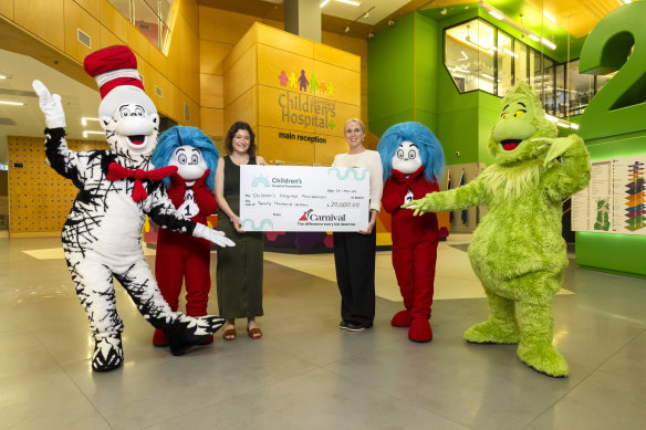 Dr Seuss characters with Brittany Butler, from the Children’s Hospital Foundation, and Carnival Cruise Line’s Kara Glamore.