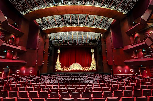 The State Theatre’s famous house curtain, which was carefully cleaned,  wrapped in plastic and stored backstage during the renovation, is now back in place.