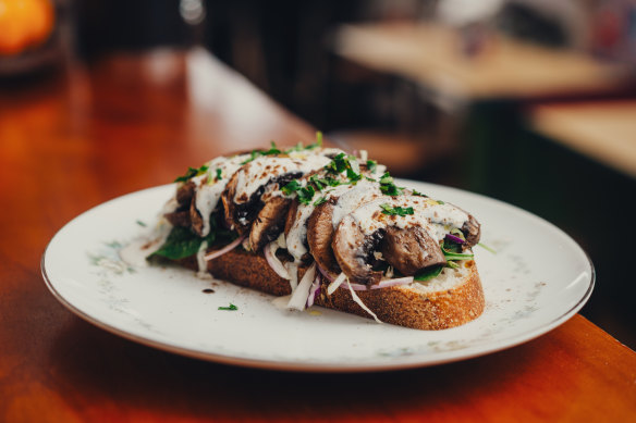 Sauteed five-spiced mushrooms with mirin on sourdough spinach and silken tofu cream.