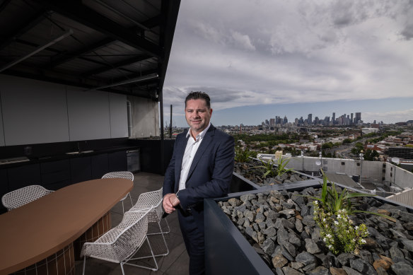 Salta Properties managing director Sam Tarascio stands on the balcony of Fitzroy and Co, the company’s pilot build-to-rent project.
