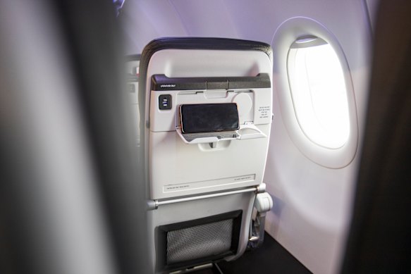 Seatbacks have a built-in device holder.