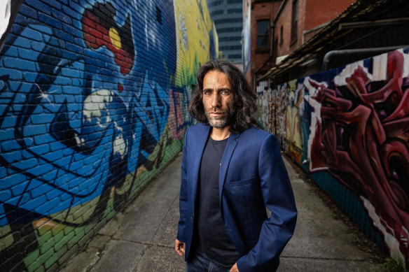 Behrouz Boochani in Melbourne on Wednesday calling for a royal commission into immigraiton detention.