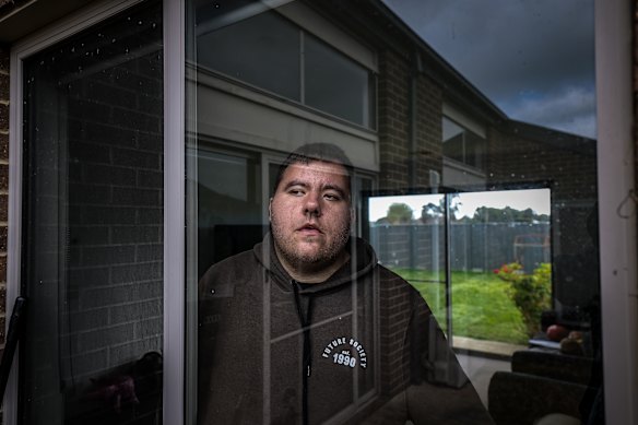 The NDIS office in Colac has closed abruptly. This closure is catastrophic for participants and support workers who need face-to-face contact with the agency for their support. NDIS client Johnny, pictured at home, is facing funding cuts to his NDIS package.