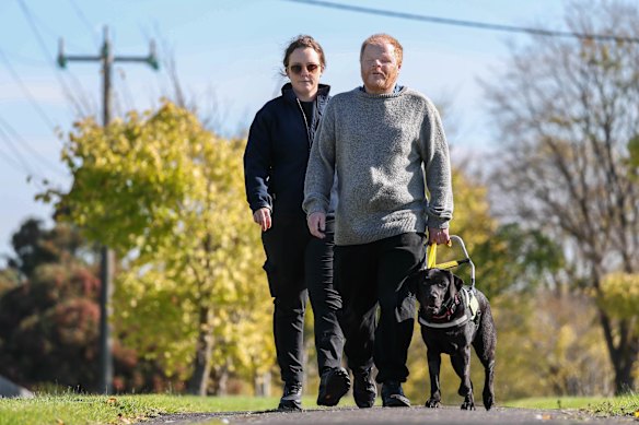 Seeing eye dog mobility instructor Katie Farrell, Phillip Chalker and his new seeing eye dog Donna in Traralgon.