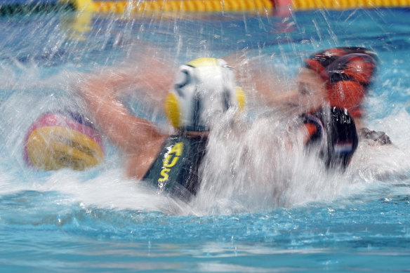 Players from Australia and the Netherlands battle for the ball.