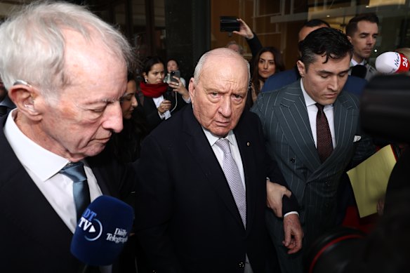 Alan Jones, flanked by his lawyers Chris Murphy and Bryan Wrench, arrives at the NSW Local Court on Monday.