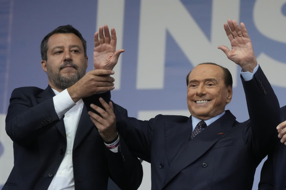 From left, Ligue 1 Matteo Salvini and Forza Italia's Silvio Berlusconi attend a center-right coalition rally in Rome before the vote.