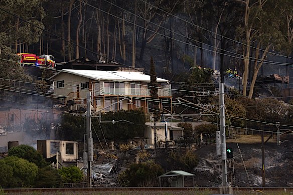 Firefighters continued to hose down smouldering ruins into the evening on Saturday at Koolewong.