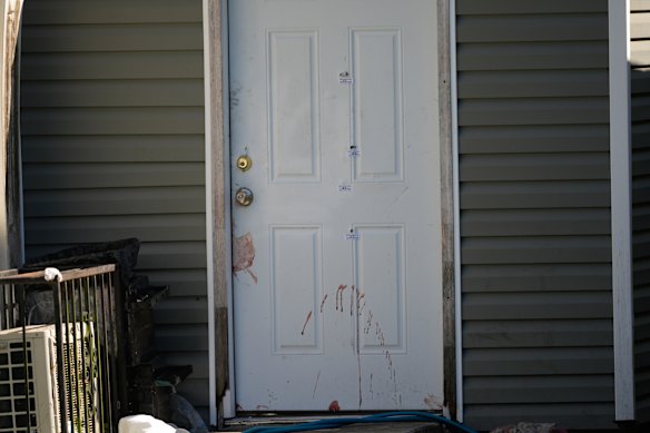 A door that appears to be stained with blood at one of the scenes.