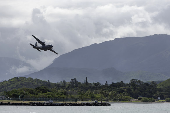 A French military plane arrives at Noumea-Magenta Airport, New Caledonia, on Thursday.