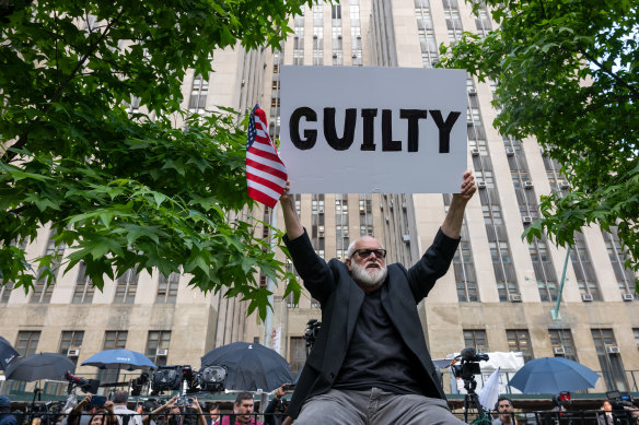 People celebrate after former president Donald Trump was found guilty on all counts at Manhattan Criminal Court on Thursday.