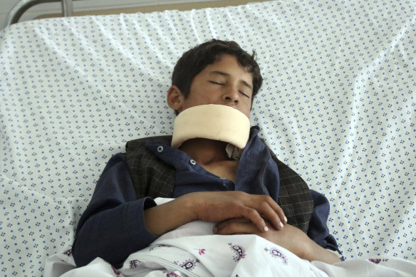 A wounded youth receives treatment at a hospital after gunmen stormed a mosque late on Tuesday, killing some worshipers and wounding several others, in Parwan province, north of Kabul, Afghanistan, on Wednesday, May 20, 2020. 