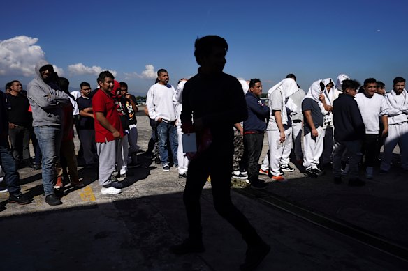Guatemalan migrants deported from the U.S. arrive at La Aurora International Airport after landing in Guatemala City.