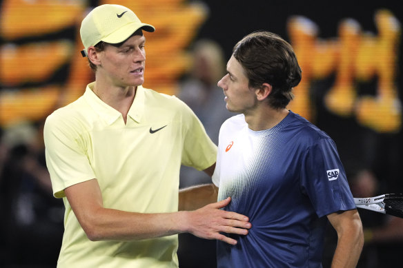 Jannik Sinner, left, of Italy is congratulated by Alex de Minaur of Australia.