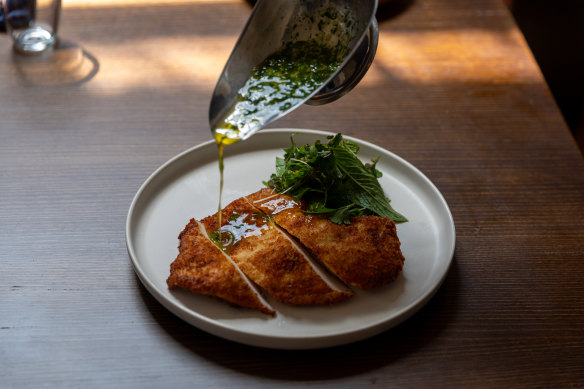 Chicken Kyiv, a crumbed schnitzel that comes with a jug of garlicky, herb-flecked butter.