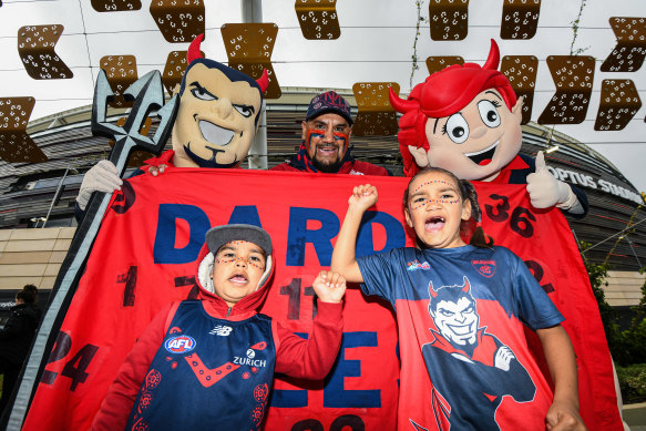 Demons fans show their support during the 2021 AFL Preliminary Final at Optus Stadium. 