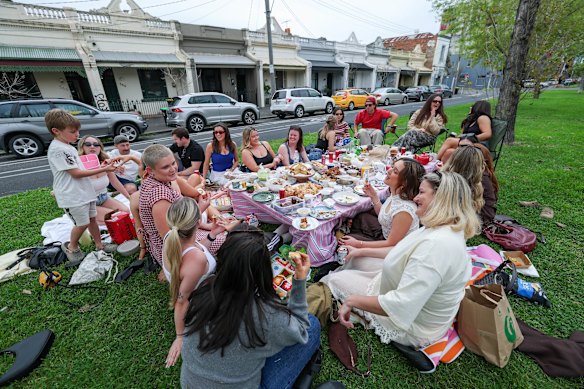 Locals enjoying a picnic on the grassy median strip of Drummond St, Carlton North.