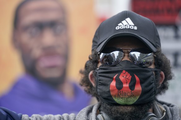A protester marches at a rally in Minneapolis.