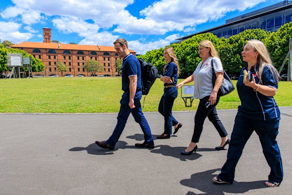 Members from the NSW Strata and Property taskforce walking to debrief after a compliance check.