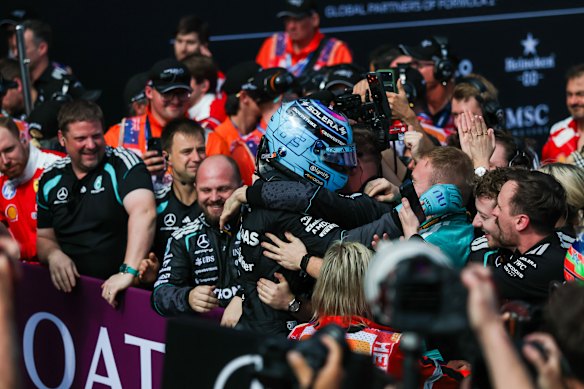 Hugs for the grand prix winner, George Russell.