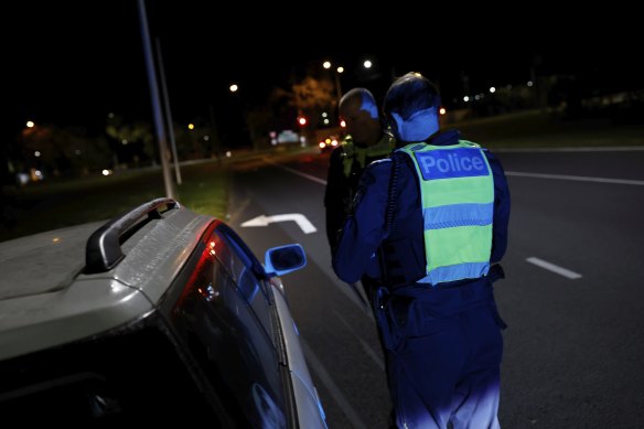 Acting Superintendent Andy McKee and his partner Sergeant Richard Clayton pull over a motorist in the early hours of August 6.