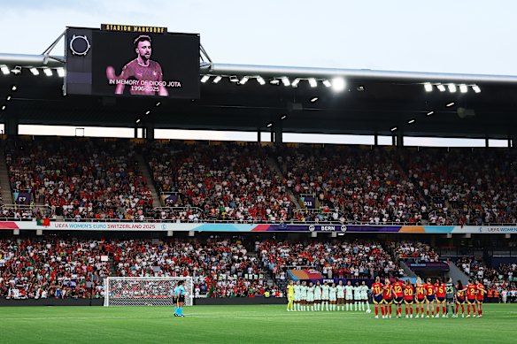 The screen displays an image of Diogo Jota, as the Spanish and Portuguese women’s teams pause for a moment of silence before their game in Bern, Switzerland, on Thursday.