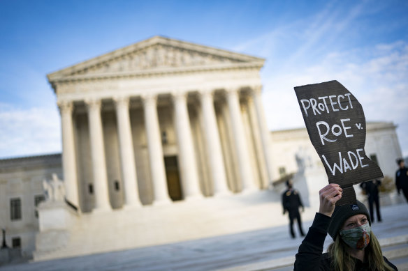 A demonstrator urges the US Supreme Court to uphold abortion rights.